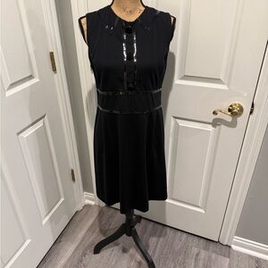 Michael Kors Black Sleeveless A-Line Mini Dress with Gloss Trim and Buttons.